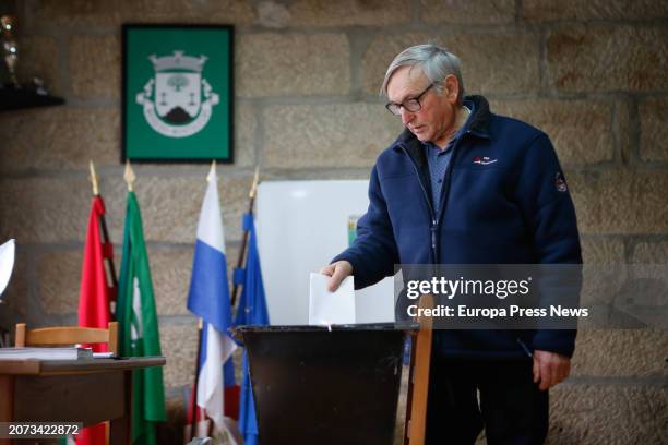 Man exercises his right to vote during voting in Portugal's parliamentary elections, at the Junta de Freguesia de Meixedo, March 10 in Meixedo,...