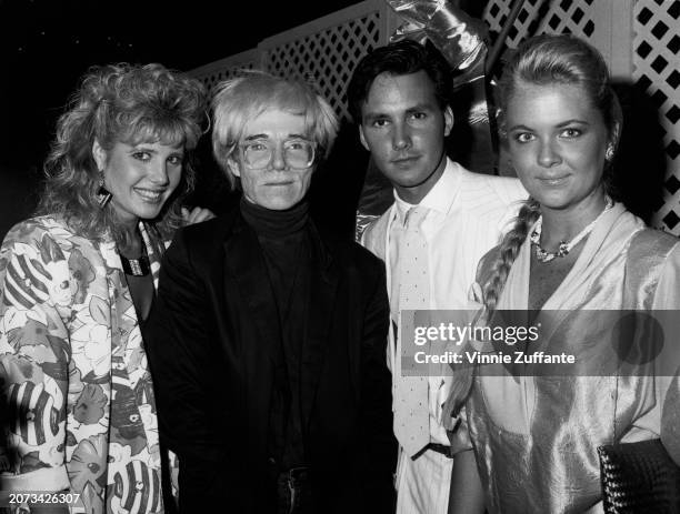 American actress Heidi Bohay, American artist Andy Warhol, American actor Phil MacGregor, and American socialite Cornelia Guest attend the premiere...