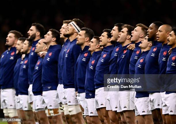 The players of France sing their national anthem prior to the Guinness Six Nations 2024 match between Wales and France at the Principality Stadium on...