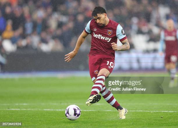 Lucas Paqueta of West Ham United scores his team's first goal during the Premier League match between West Ham United and Burnley FC at the London...