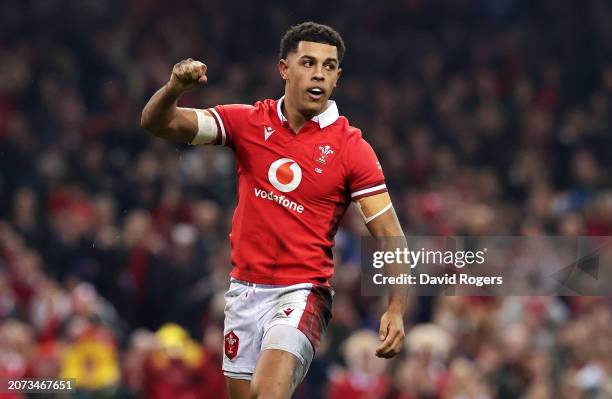 Rio Dyer of Wales celebrates after scoring his team's first try during the Guinness Six Nations 2024 match between Wales and France at the...