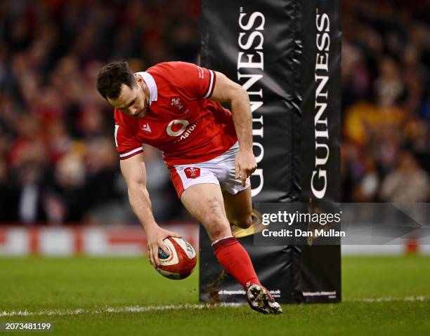 Tomos Williams of Wales scores his team's second try during the Guinness Six Nations 2024 match between Wales and France at the Principality Stadium...