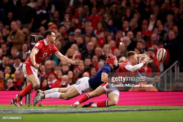 Tomos Williams of Wales prevents Louis Bielle-Biarrey of France from scoring a try during the Guinness Six Nations 2024 match between Wales and...