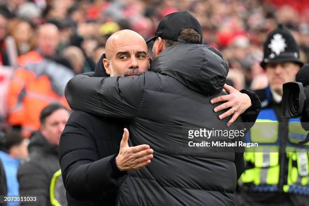 Pep Guardiola, Manager of Manchester City, and Jurgen Klopp, Manager of Liverpool, embrace prior to the Premier League match between Liverpool FC and...