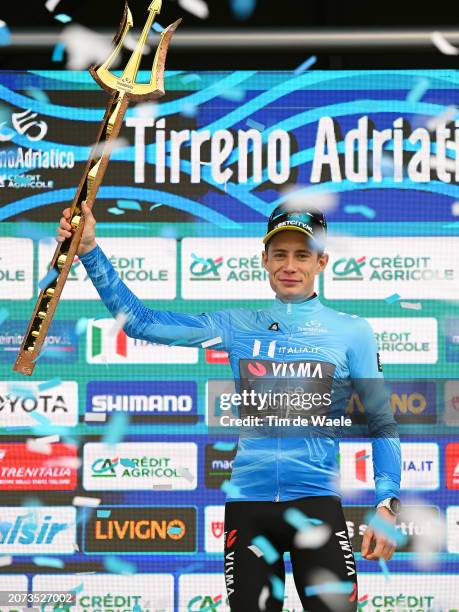 Jonas Vingegaard Hansen of Denmark and Team Visma-Lease A Bike celebrates at podium as race winner and Blue Leader Jersey with Trident Race Trophy...