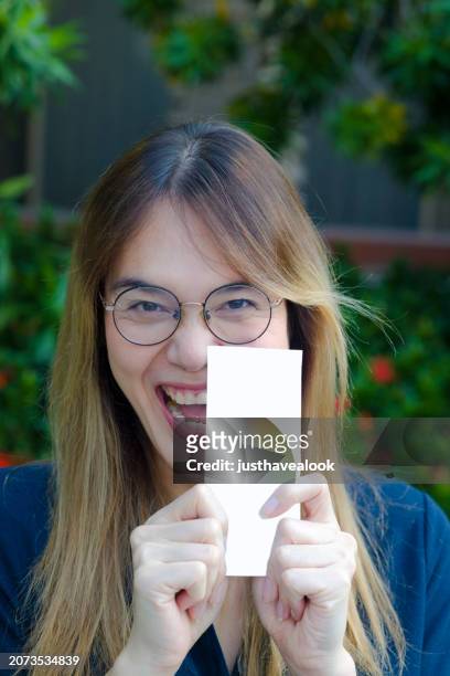 happy big smiling thai transgender holding  lottery ticket - kathoey stock pictures, royalty-free photos & images