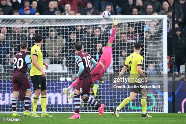 Danny Ings of West Ham United shoots and hits the crossbar during the Premier League match between West Ham United and Burnley FC at the London...