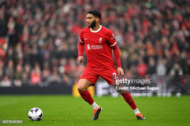 Joe Gomez of Liverpool runs with the ball during the Premier League match between Liverpool FC and Manchester City at Anfield on March 10, 2024 in...