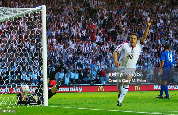 Michael Owen of England celebrates after scoring the second goal during the England v Slovakia European Championship 2004 qualifying match on June...