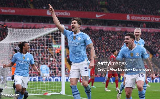 John Stones of Manchester City celebrates after scoring their opening goal during the Premier League match between Liverpool FC and Manchester City...