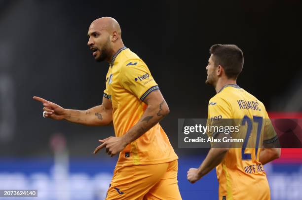 John Brooks of TSG 1899 Hoffenheim celebrates scoring his team's first goal during the Bundesliga match between Eintracht Frankfurt and TSG...