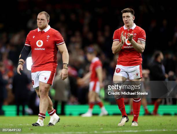 Corey Domachowski and Josh Adams of Wales applaud the fans at full-time following the team's defeat in the Guinness Six Nations 2024 match between...
