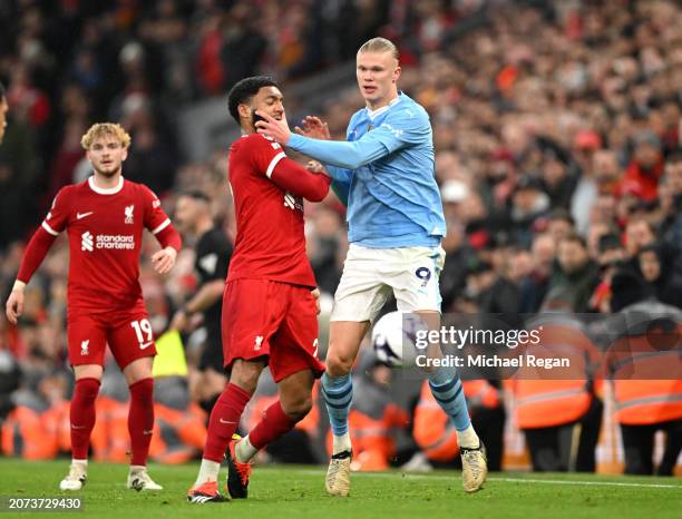 Joe Gomez of Liverpool and Erling Haaland of Manchester City clash during the Premier League match between Liverpool FC and Manchester City at...