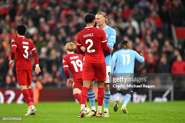 Joe Gomez of Liverpool and Erling Haaland of Manchester City clash during the Premier League match between Liverpool FC and Manchester City at...