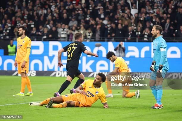 Kevin Akpoguma of TSG 1899 Hoffenheim reacts as Mario Goetze of Eintracht Frankfurt scores his team's third goal during the Bundesliga match between...