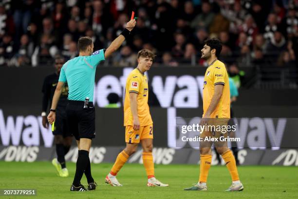 Ozan Kabak of TSG 1899 Hoffenheim is shown a red card by Referee Bastian Dankert during the Bundesliga match between Eintracht Frankfurt and TSG...