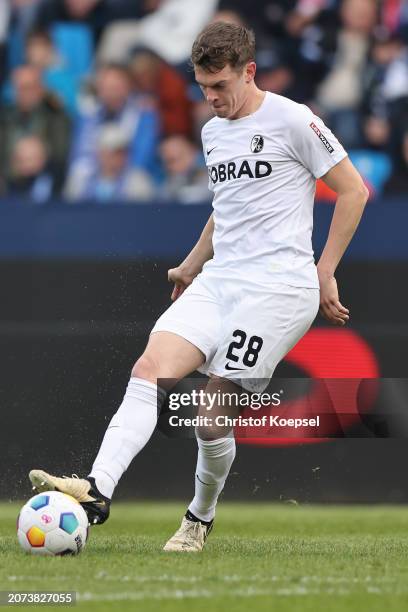 Matthias Ginter of Freiburg runs with the ball during the Bundesliga match between VfL Bochum 1848 and Sport-Club Freiburg at Vonovia Ruhrstadion on...