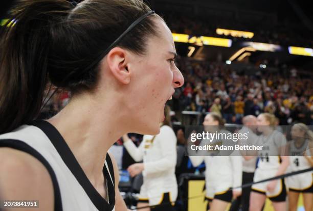 Caitlin Clark of the Iowa Hawkeyes celebrates defeating the Nebraska Cornhuskers 94-89 in overtime to win the Big Ten Women's Basketball Tournament...