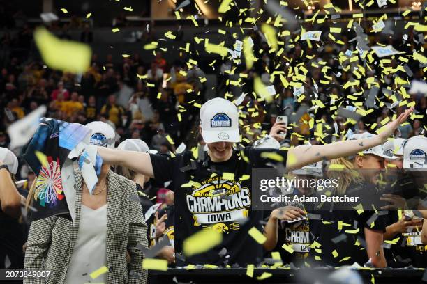 Caitlin Clark of the Iowa Hawkeyes celebrates defeating the Nebraska Cornhuskers 94-89 in overtime to win the Big Ten Women's Basketball Tournament...