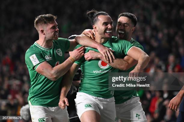 James Lowe of Ireland celebrates with team mates Jack Crowley and Conor Murray after scoring his 2nd try during the Guinness Six Nations 2024 match...