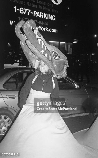 View of a woman, wearing an elaborate mask and hoop skirt costume, during the 29th annual Village Halloween Parade, on 6th Avenue, New York, New...