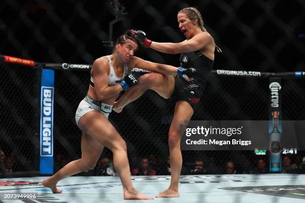 Maycee Barber and Katlyn Cerminara fight during their women's flyweight bout at UFC 299 at Kaseya Center on March 09, 2024 in Miami, Florida.