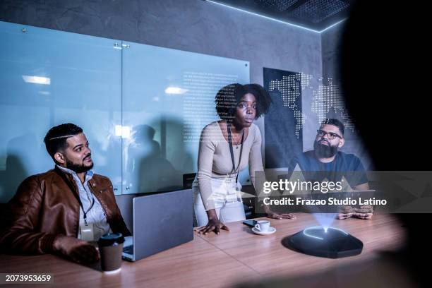 coworkers using augmented reality device during a meeting at office - virtual table stock pictures, royalty-free photos & images