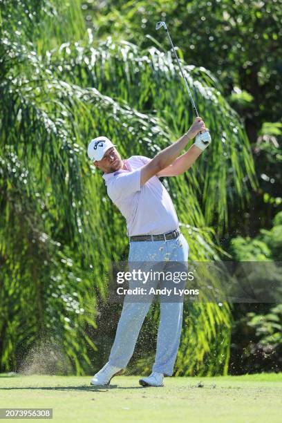 Brice Garnett of the United States plays his shot from the 11th tee during the final round of the Puerto Rico Open at Grand Reserve Golf Club on...