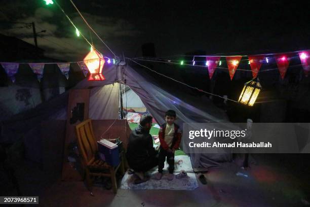 Rafah, Gaza Displaced Palestinians decorate their tent in preparation for the holy month of Ramadan on March 10, 2024 in Rafah, Gaza. The United...