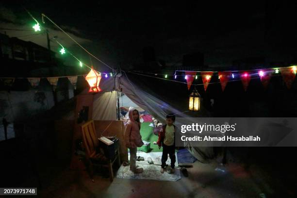 Rafah, Gaza Displaced Palestinians decorate their tent in preparation for the holy month of Ramadan on March 10, 2024 in Rafah, Gaza. The United...