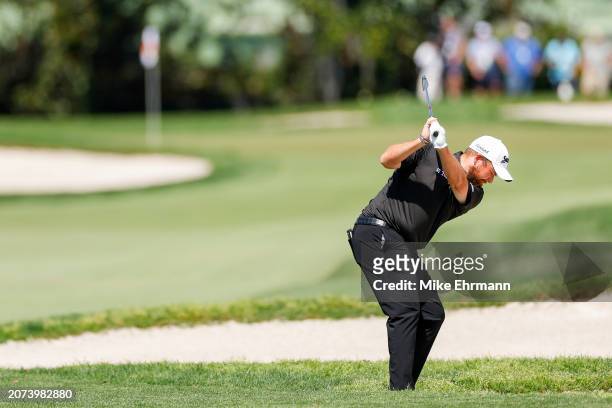 Shane Lowry of Ireland hits an approach shot on the first hole during the final round of the Arnold Palmer Invitational presented by Mastercard at...