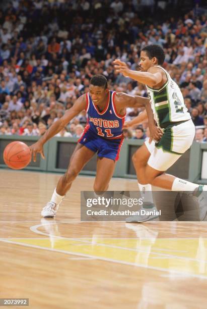 Isiah Thomas of the Detroit Pistons drives to the basket in a game against the Milwaukee Bucks at The Bradley Center in Milwaukee, Wisconsin during...