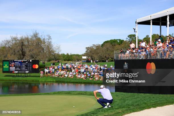Scottie Scheffler of the United States looks over a putt on the eighth hole during the final round of the Arnold Palmer Invitational presented by...