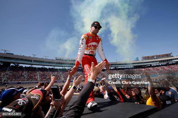 Erik Jones, driver of the Family Dollar Toyota, greets fans onstage during driver intros prior to the NASCAR Cup Series Shriners Children's 500 at...