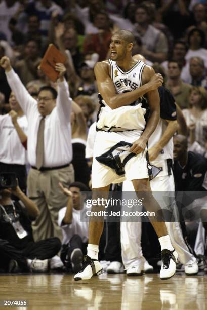 Tim Duncan of the San Antonio Spurs celebrates in Game two of the 2003 NBA Finals against the New Jersey Nets at SBC Center on June 6, 2003 in San...