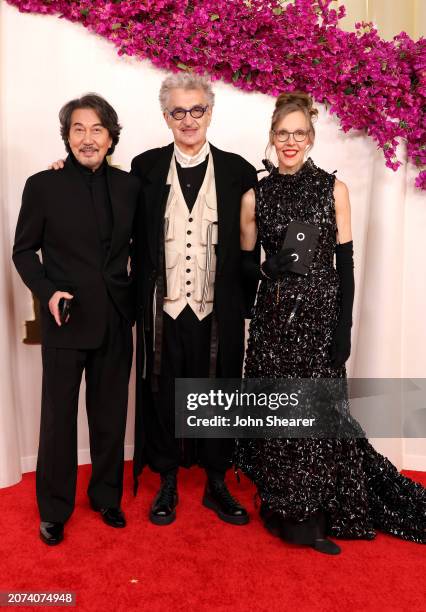 Kōji Yakusho, Wim Wenders, and Donata Wenders attend the 96th Annual Academy Awards on March 10, 2024 in Hollywood, California.