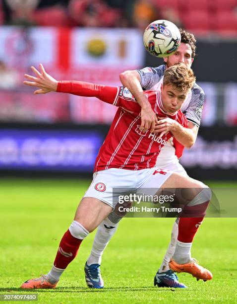 Tommy Conway of Bristol City battles for possession with Joe Allen of Swansea City during the Sky Bet Championship match between Bristol City and...