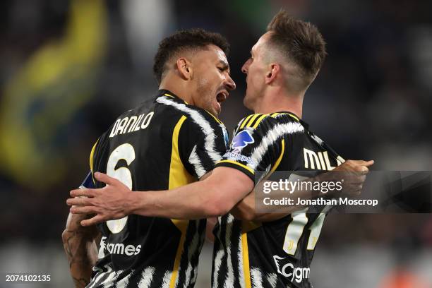 Arkadiusz Milik of Juventus is embraced by teammate Danilo after scoring to give their side a 2-1 lead during the Serie A TIM match between Juventus...