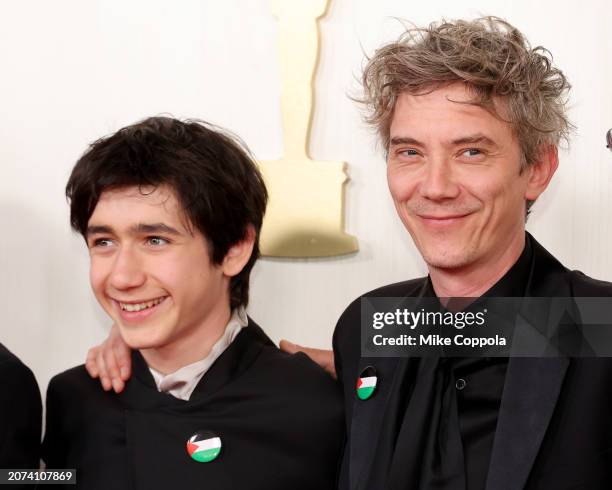 Milo Machado-Graner and Swann Arlaud attends the 96th Annual Academy Awards on March 10, 2024 in Hollywood, California.
