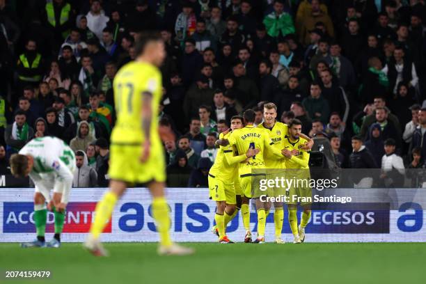 Alexander Sorloth of Villarreal CF celebrates scoring his team's third goal with teammates during the LaLiga EA Sports match between Real Betis and...