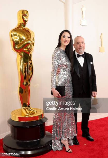 Clara Wong and Paul Giamatti attend the 96th Annual Academy Awards on March 10, 2024 in Hollywood, California.