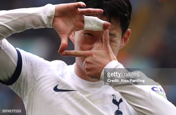 Son Heung-Min of Tottenham Hotspur celebrates scoring his sides third goal during the Premier League match between Aston Villa and Tottenham Hotspur...