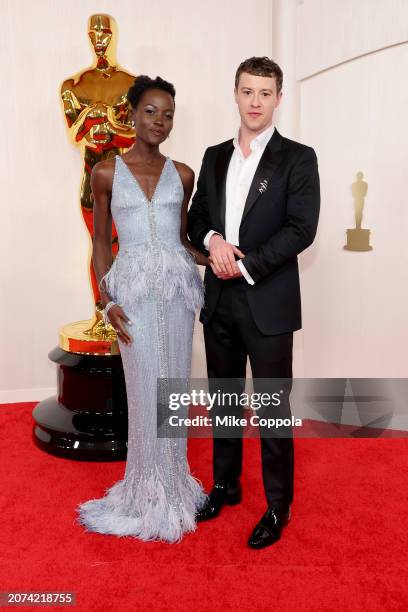 Lupita Nyong'o and Joseph Quinn attend the 96th Annual Academy Awards on March 10, 2024 in Hollywood, California.