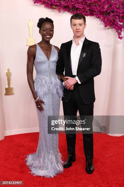 Lupita Nyong'o and Joseph Quinn attend the 96th Annual Academy Awards on March 10, 2024 in Hollywood, California.