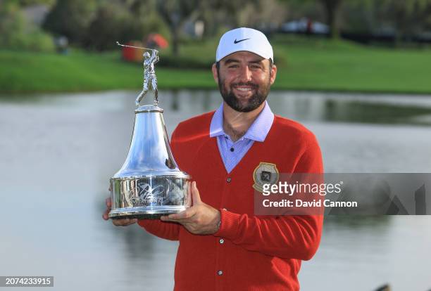 Scottie Scheffler of The United States holds the trophy after the final round of the Arnold Palmer Invitational presented by Mastercard at Arnold...