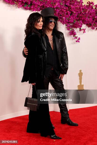 Meegan Hodges and Slash attend the 96th Annual Academy Awards on March 10, 2024 in Hollywood, California.