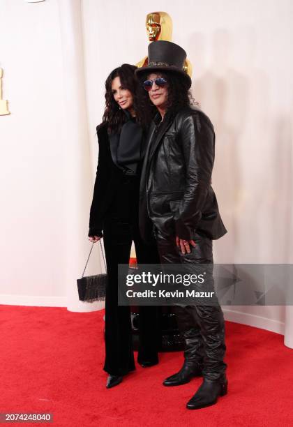 Meegan Hodges and Slash attend the 96th Annual Academy Awards on March 10, 2024 in Hollywood, California.