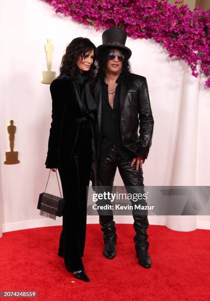 Meegan Hodges and Slash attend the 96th Annual Academy Awards on March 10, 2024 in Hollywood, California.