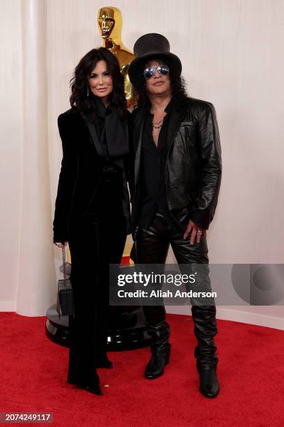 Meegan Hodges and Slash attend the 96th Annual Academy Awards on March 10, 2024 in Hollywood, California.