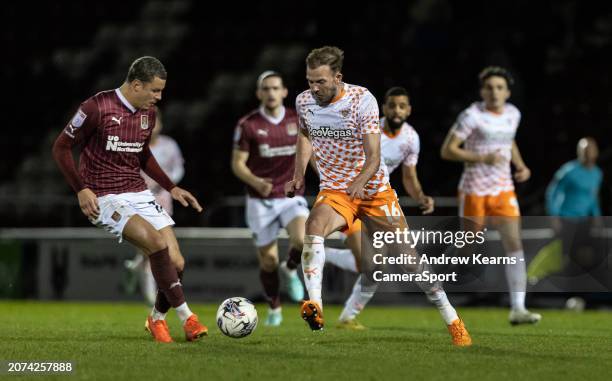 Blackpool's Jordan Rhodes competing with Northampton Town's Shaun McWilliams during the Sky Bet League One match between Northampton Town and...